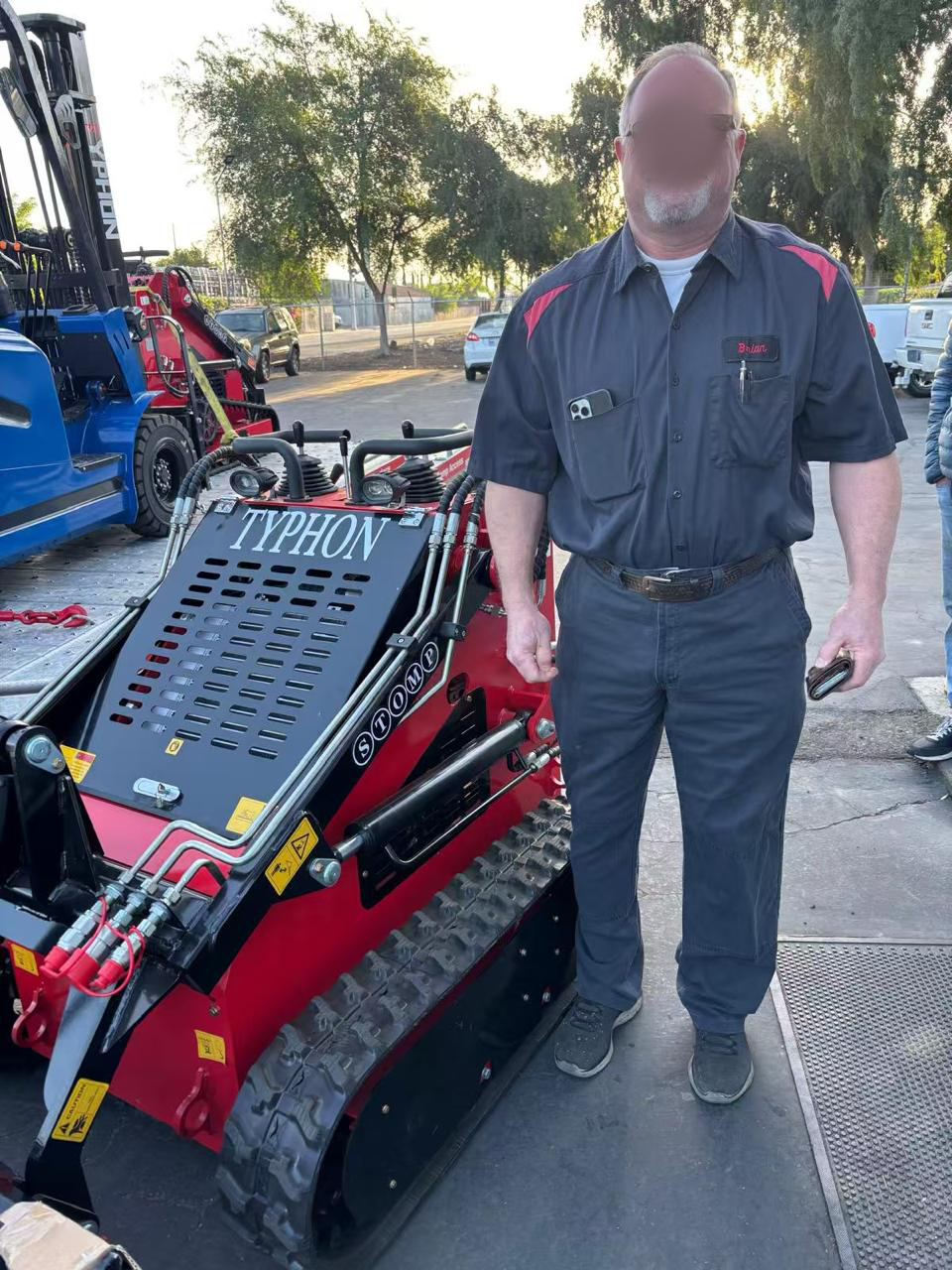 Client using machine attachment in the field